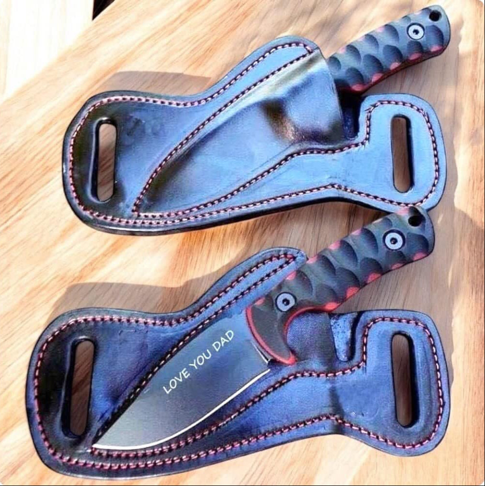 Set of knives with leather sheaths on a wooden surface